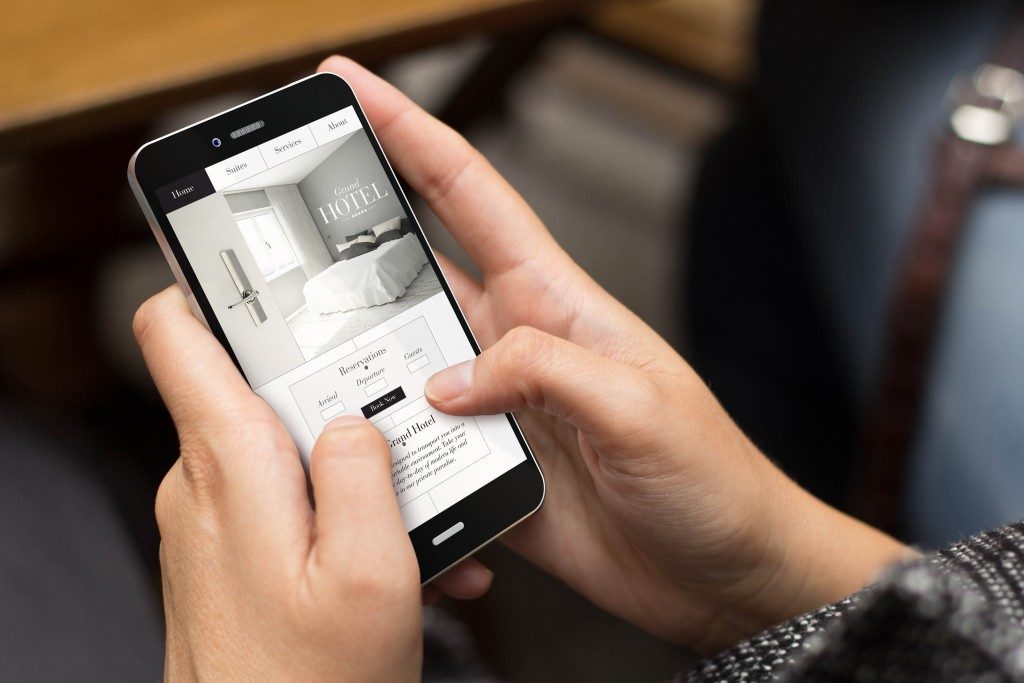 Person looking at hotel website on mobile