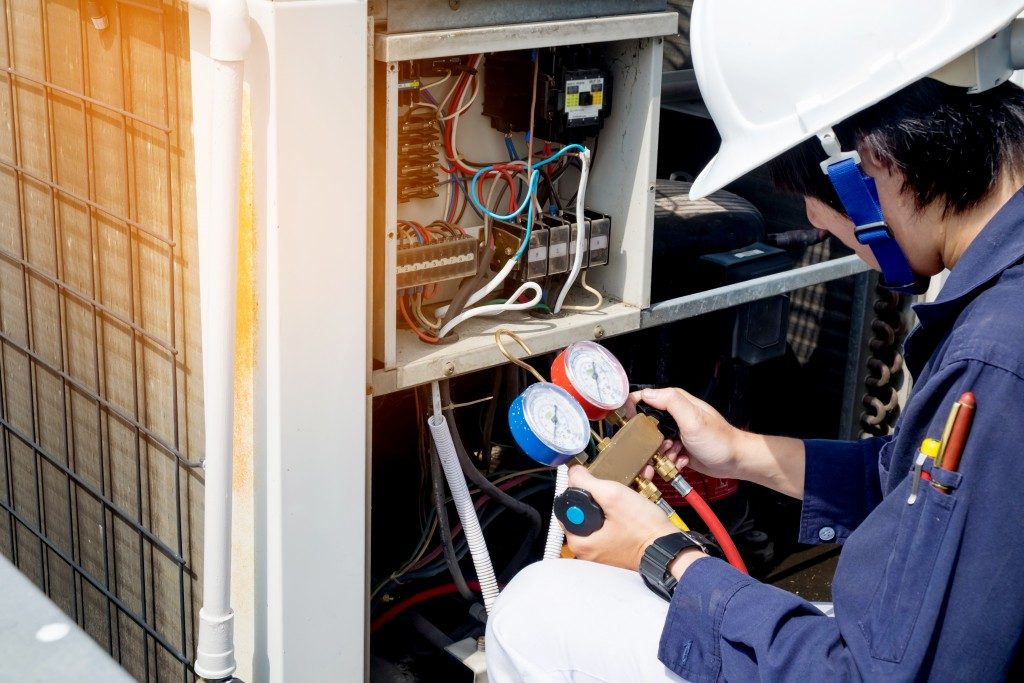 man installing heater