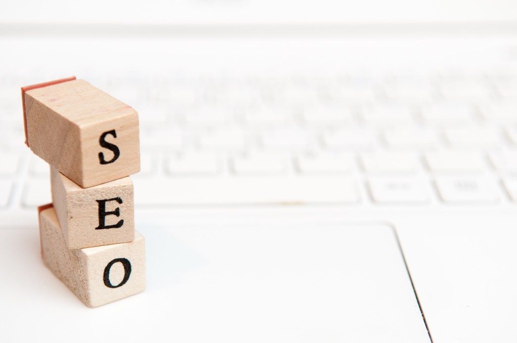 miniature seo blocks on top of a white laptop