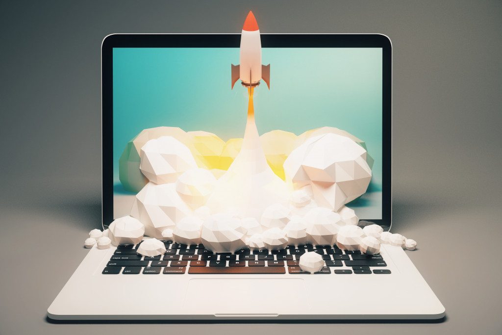 a laptop and a rocket